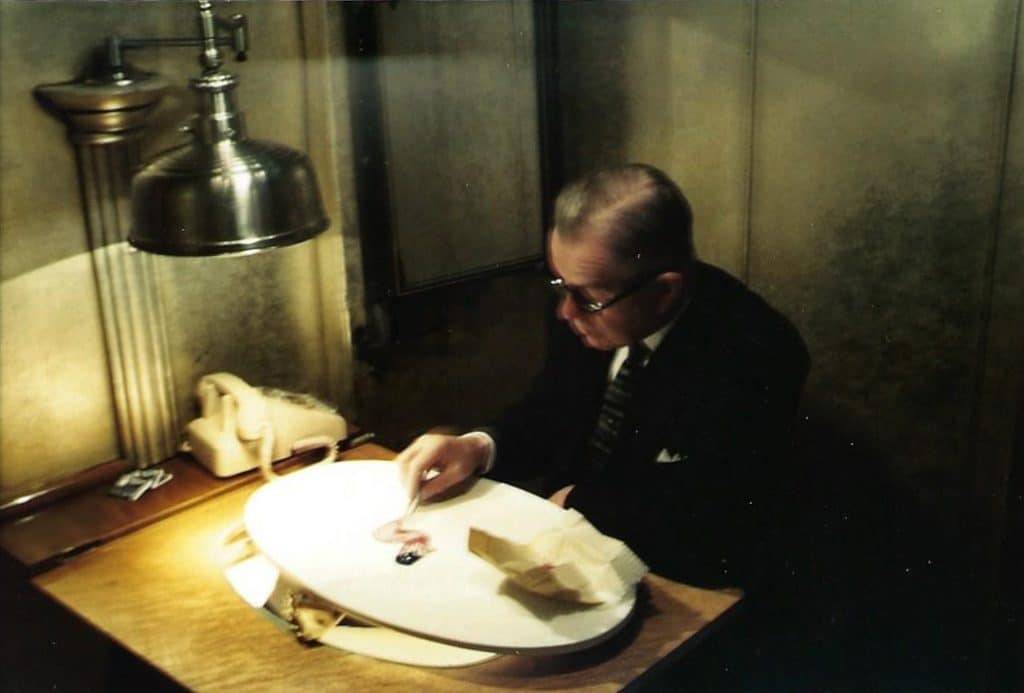 Caption: Milton Beattie creating a waving flag display. He created similar designs so often in his career, that from beginning to end, the display took 30 minutes to create.